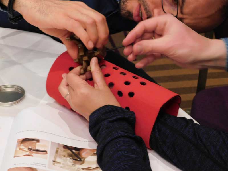 teambuilding-team-building-working-together-to-assemble-prosthetic-hand